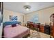 Bright bedroom with queen bed, workspace, and ample closet space at 37209 N 12Th St, Phoenix, AZ 85086