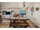 Rustic farmhouse dining area with a large wooden table and bench at 37209 N 12Th St, Phoenix, AZ 85086