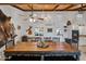 Rustic dining area with large wood table and decorative accents at 37209 N 12Th St, Phoenix, AZ 85086