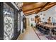 Entryway with unique black double doors and wood ceiling beams at 37209 N 12Th St, Phoenix, AZ 85086