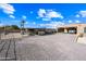 Spacious property with covered parking, horse stalls, and a large gravel area at 37209 N 12Th St, Phoenix, AZ 85086