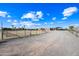 Ranch style home with a long gravel driveway, horse corral, and covered parking at 37209 N 12Th St, Phoenix, AZ 85086