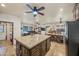 Open concept kitchen with large island and breakfast bar at 37209 N 12Th St, Phoenix, AZ 85086