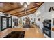 Kitchen features island, wood ceiling beams, and stainless steel appliances at 37209 N 12Th St, Phoenix, AZ 85086