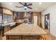 Large kitchen island with granite countertop and seating at 37209 N 12Th St, Phoenix, AZ 85086