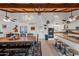 Large kitchen with island, white cabinets, and wood ceiling beams at 37209 N 12Th St, Phoenix, AZ 85086