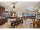 Open kitchen features granite countertops and dark wood cabinets at 37209 N 12Th St, Phoenix, AZ 85086