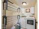 Laundry room with washer, dryer, and ample storage at 37209 N 12Th St, Phoenix, AZ 85086