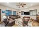 Relaxing living room with a leather couch and rocking chair at 37209 N 12Th St, Phoenix, AZ 85086