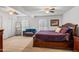 Main bedroom with large bed, ceiling fan, and ample closet space at 37209 N 12Th St, Phoenix, AZ 85086