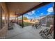 Covered patio with seating area, picnic table, and grassy yard at 37209 N 12Th St, Phoenix, AZ 85086