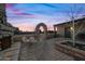 Relaxing patio area with a stone fireplace and seating at 37209 N 12Th St, Phoenix, AZ 85086