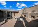 Brick patio with a stone fireplace and small garden at 37209 N 12Th St, Phoenix, AZ 85086