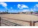 Large sand riding arena with perimeter fencing at 37209 N 12Th St, Phoenix, AZ 85086