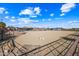 Large sand riding arena with perimeter fencing at 37209 N 12Th St, Phoenix, AZ 85086