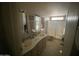 Bathroom with double sinks and shower at 3721 N Illinois Ave, Florence, AZ 85132