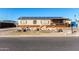 Single wide manufactured home with solar panels and a gravel driveway at 3810 W Mohawk Ln, Glendale, AZ 85308