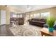 Open living room and dining area with a view into the kitchen at 3810 W Mohawk Ln, Glendale, AZ 85308