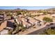 Aerial view of a house and neighborhood with mountain views at 3818 N Lomond Cir, Mesa, AZ 85215