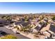 Aerial view of houses in a neighborhood with mountain backdrop at 3818 N Lomond Cir, Mesa, AZ 85215