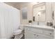 Updated bathroom with white vanity and shower/tub combo at 3818 N Lomond Cir, Mesa, AZ 85215