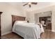 Bright bedroom with built-in desk and ceiling fan at 3818 N Lomond Cir, Mesa, AZ 85215