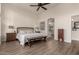 Main bedroom with king bed, ceiling fan and access to bathroom at 3818 N Lomond Cir, Mesa, AZ 85215