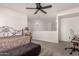 Bedroom with ceiling fan, and a view to a loft area at 3818 N Lomond Cir, Mesa, AZ 85215