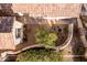 Backyard view with a curved wall and a tree at 3818 N Lomond Cir, Mesa, AZ 85215