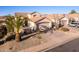 Two-story house with attached garage and nicely landscaped front yard at 3818 N Lomond Cir, Mesa, AZ 85215