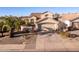 Two-story house with attached garage and nicely landscaped front yard at 3818 N Lomond Cir, Mesa, AZ 85215