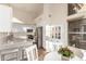 Open concept kitchen with white cabinets, breakfast bar and stainless steel appliances at 3818 N Lomond Cir, Mesa, AZ 85215