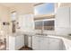 Kitchen with white cabinets, granite countertops, and stainless steel appliances at 3818 N Lomond Cir, Mesa, AZ 85215