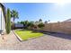 Landscaped backyard with artificial turf and fruit trees at 4009 W Cielo Grande Rd, Glendale, AZ 85310