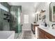 Elegant bathroom with double vanities, walk-in shower, and modern finishes at 4009 W Cielo Grande Rd, Glendale, AZ 85310