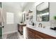 Modern bathroom with double vanity, stylish tile and walk-in shower at 4009 W Cielo Grande Rd, Glendale, AZ 85310