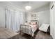 Charming bedroom with a metal bed frame and window curtains at 4009 W Cielo Grande Rd, Glendale, AZ 85310