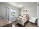 Charming bedroom with a metal bed frame and window curtains at 4009 W Cielo Grande Rd, Glendale, AZ 85310