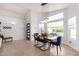 Spacious dining area with large windows and a contemporary light fixture at 4009 W Cielo Grande Rd, Glendale, AZ 85310