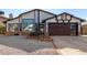 Updated home exterior boasts a modern garage door and attractive landscaping at 4009 W Cielo Grande Rd, Glendale, AZ 85310