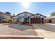 Updated home exterior with new paint and landscaping at 4009 W Cielo Grande Rd, Glendale, AZ 85310