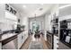 Modern kitchen with white cabinets, stainless steel appliances, and a breakfast nook at 4009 W Cielo Grande Rd, Glendale, AZ 85310