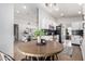 Kitchen nook with a round table and chairs, offering a view into the living room at 4009 W Cielo Grande Rd, Glendale, AZ 85310