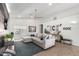 Spacious living room with sectional sofa and wood accent wall at 4009 W Cielo Grande Rd, Glendale, AZ 85310