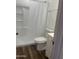 Clean bathroom with a shower/tub combo, white vanity, and wood-look flooring at 404 W 13Th St, Eloy, AZ 85131