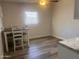 Bright dining area with wood-look flooring and a four-person table at 404 W 13Th St, Eloy, AZ 85131