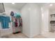 Walk-in closet with ample hanging space and shelving at 40561 W Hillman Dr, Maricopa, AZ 85138