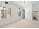 Bright bedroom with neutral carpet, a ceiling fan, and windows with plantation shutters at 4430 N 22Nd St # 1, Phoenix, AZ 85016