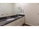 Elegant bathroom with a double vanity, granite countertop, and sleek fixtures, offering a luxurious feel at 44512 N Sonoran Arroyo Ln, New River, AZ 85087