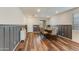 Well-lit dining room with wood floors, wainscoting, a large table, and seating for eight at 44512 N Sonoran Arroyo Ln, New River, AZ 85087